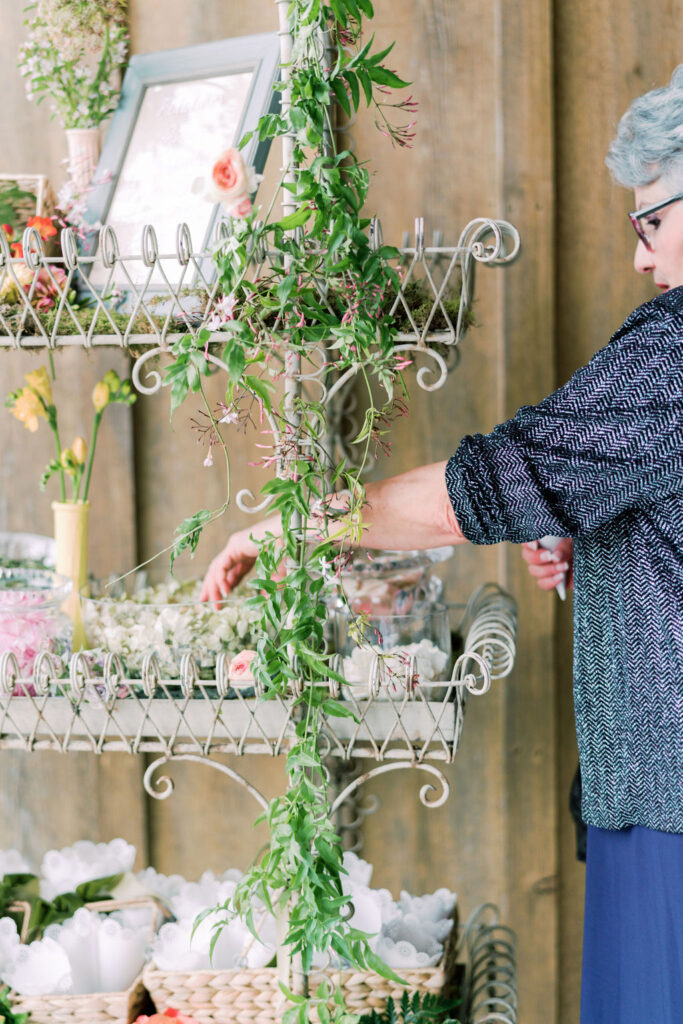 Guest creating flower petal cup to toss during ceremony exit