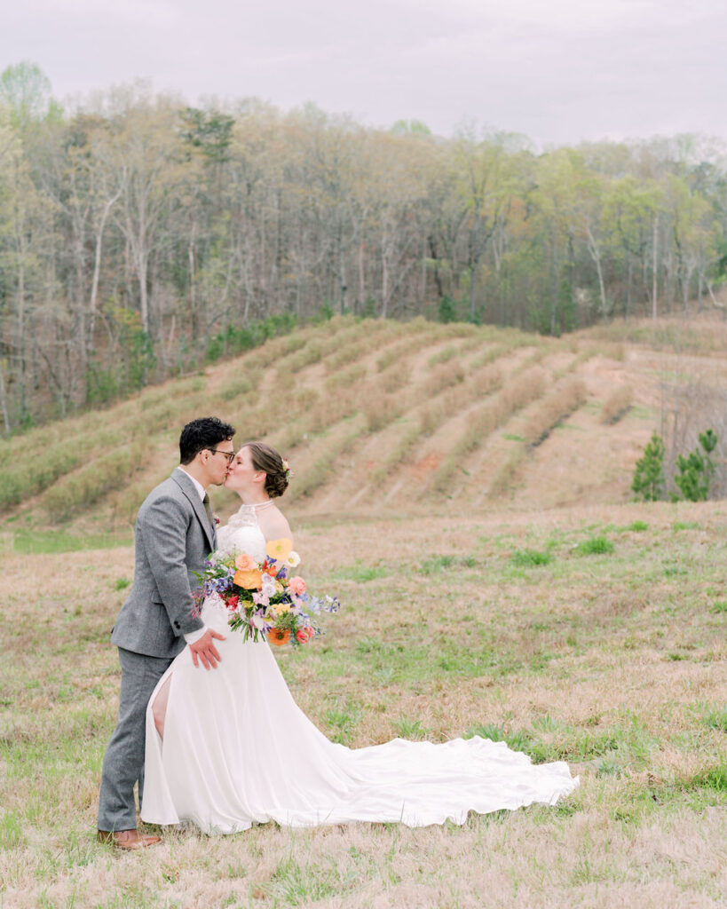 Newlyweds with farm views in background