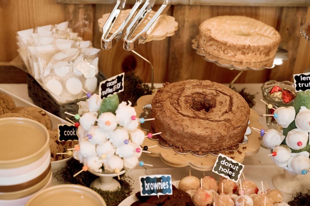 Dessert display at wedding with cake and cake pops