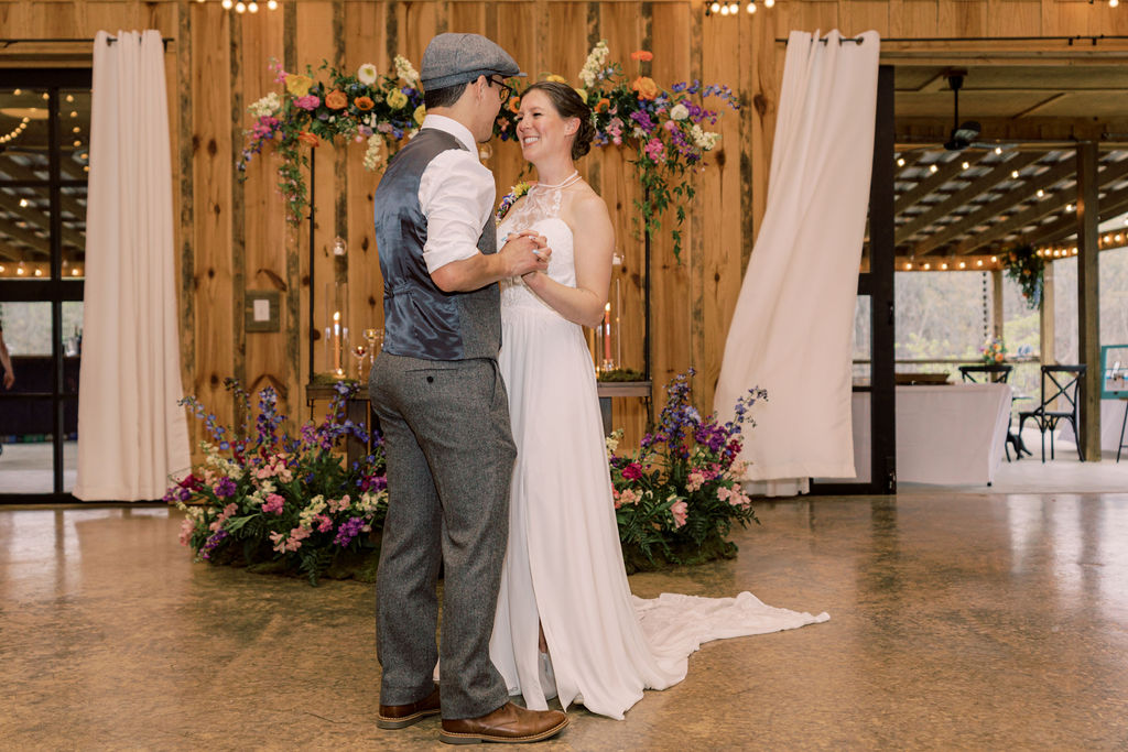 First dance at wedding reception at barn wedding venue