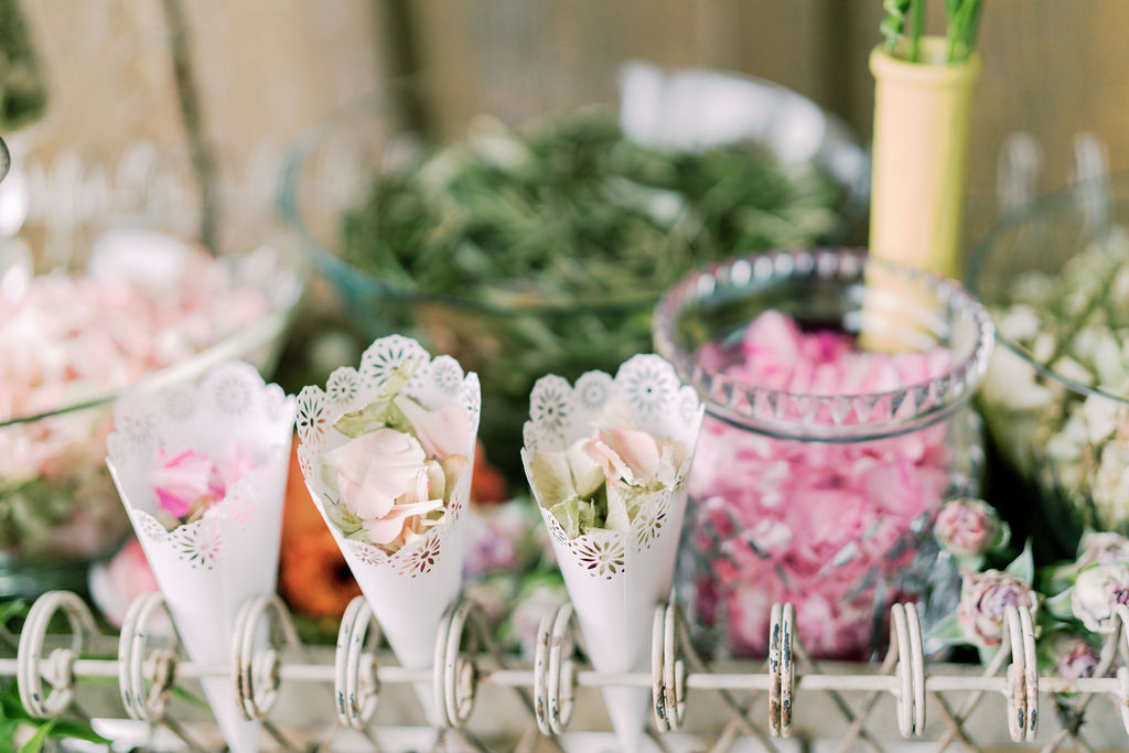 Pretty paper cups filled with flower petals