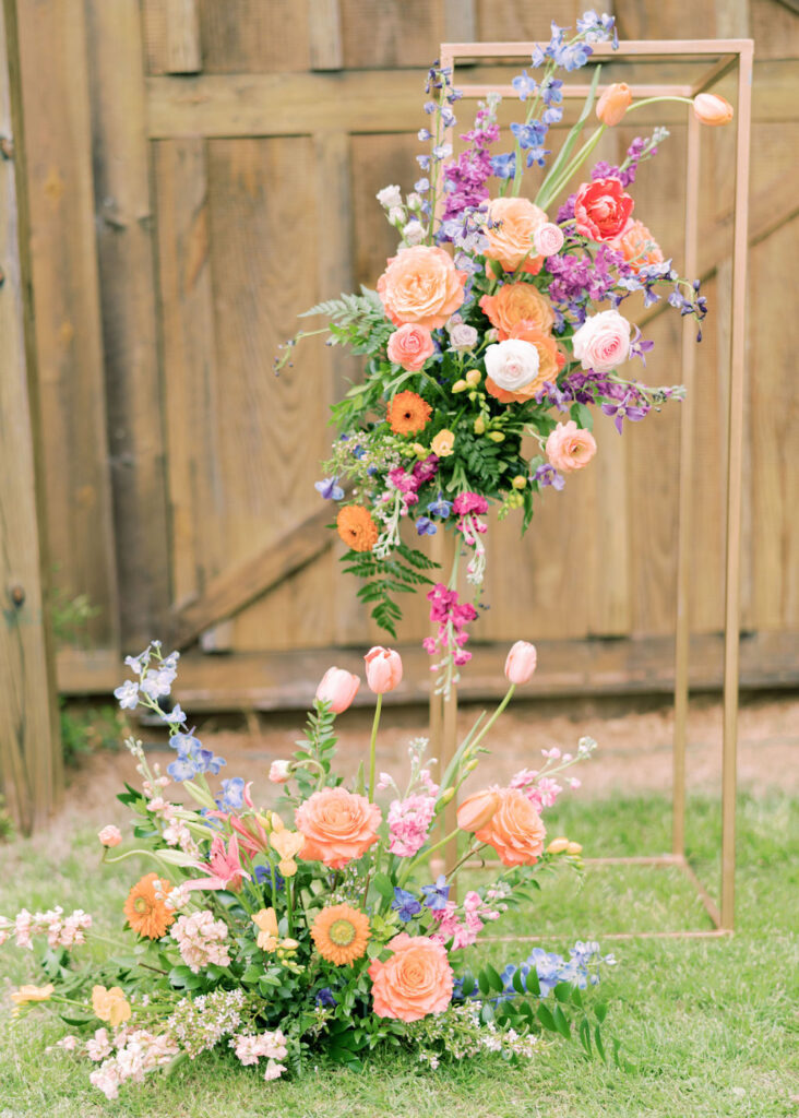 Invisible floral arch with bright spring flowers